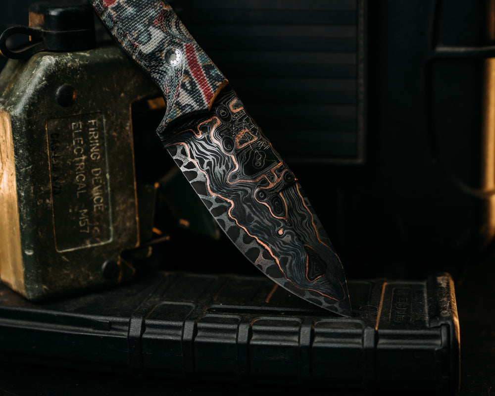 Hog Hunt Jr.- Adam Deville Damascus- P. Kaufmann Milos Lakeland Blue Paisley Micarta, Glow Pins