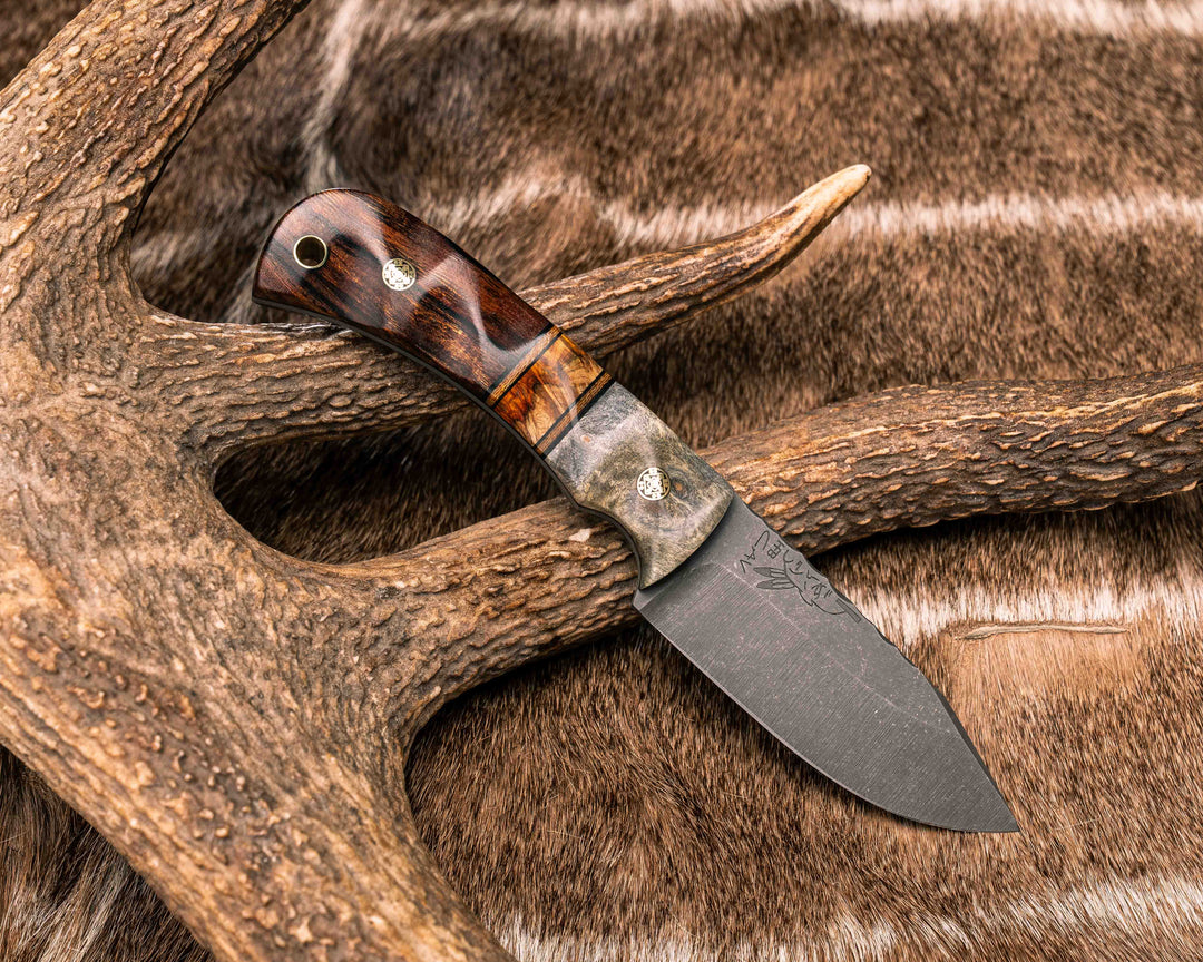 Modified Cav Jr- Buckeye Burl, Black G10 and Natural Canvas Micarta Pin Striping, Lion's Blood Amboyna Split, Desert Ironwood, Brass Mosaic Pins, Brass Lanyard Pin, Textured Grip