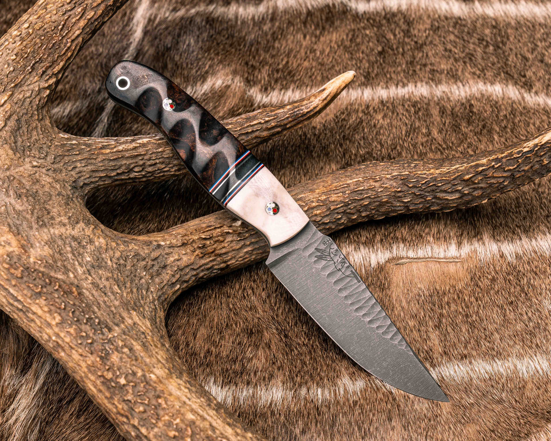 Modified Crow Jr- Giraffe Bone, Black G10, Cherry G10, White G10, Blue G10 and Brass Pin Striping, Black G10 Split, Desert Ironwood, Patriot Mosaic Pins, Aluminum Lanyard Pin, Textured Grip