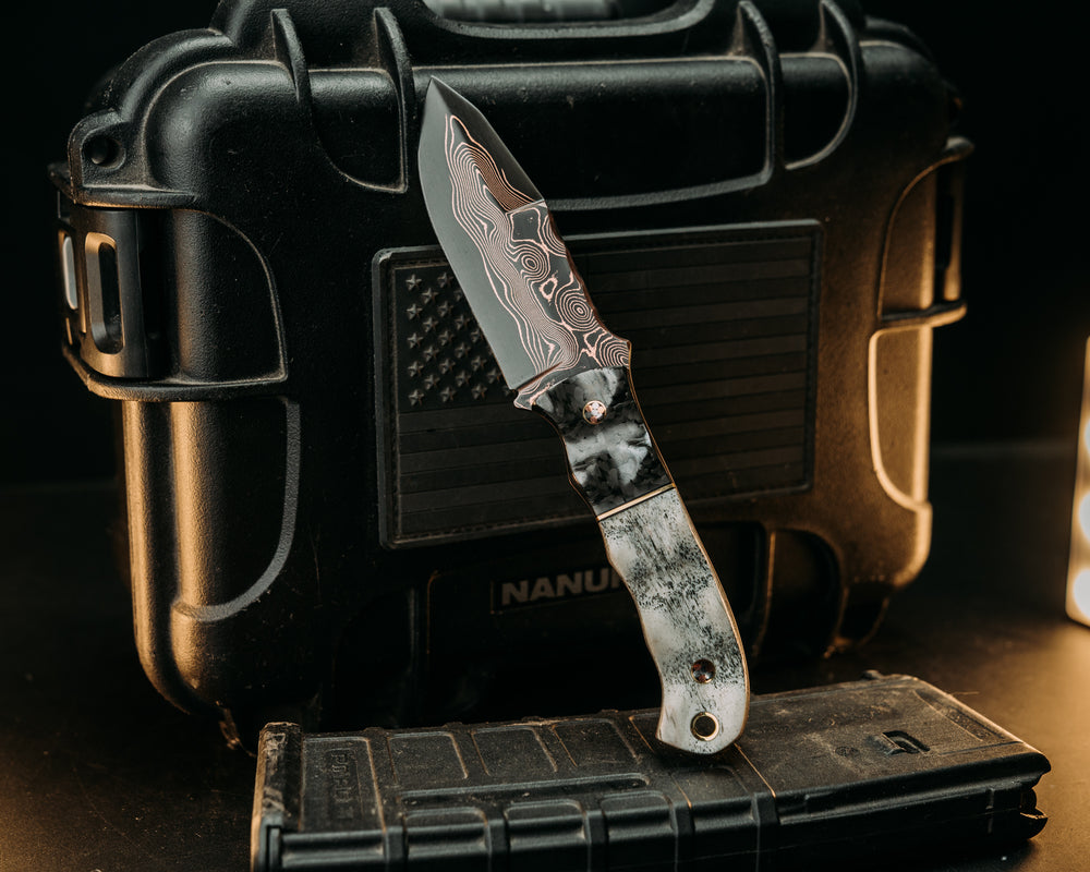 Disaster Cub- Baker Forge Raindrop CopperMai- Carbon Fiber, Black G10 and Brass Split, Elk Antler, Mosaic Pins, Brass Lanyard Pin, Textured Grip