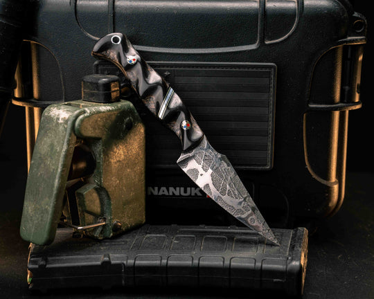 Gulo Gulo- Rams Horn Over Dyed Box Elder, Black G10, Brass and Aluminum Split, Patriot Mosaic Pins, Aluminum Lanyard Pin, Textured Grip