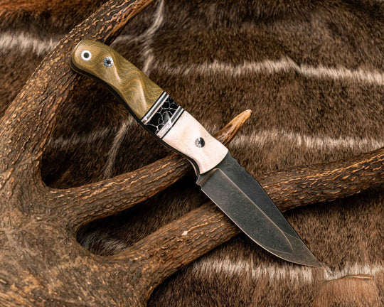 Crow Jr (Compound Grind)- Elk Antler, Black G10, White G10 and Aluminum Pin Striping, Black with White Web Tru-stone Split, Olive Green Canvas Micarta, Mosaic Pins, Aluminum Lanyard Pin, Textured Grip