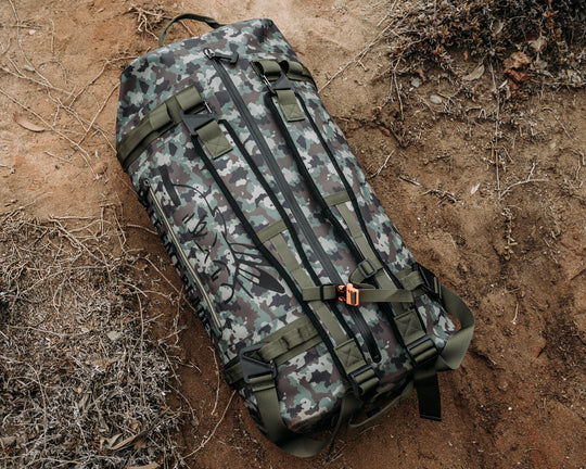 Uncharted Supply Co. x Half Face Blades - The Vault 65L Duffel Bag