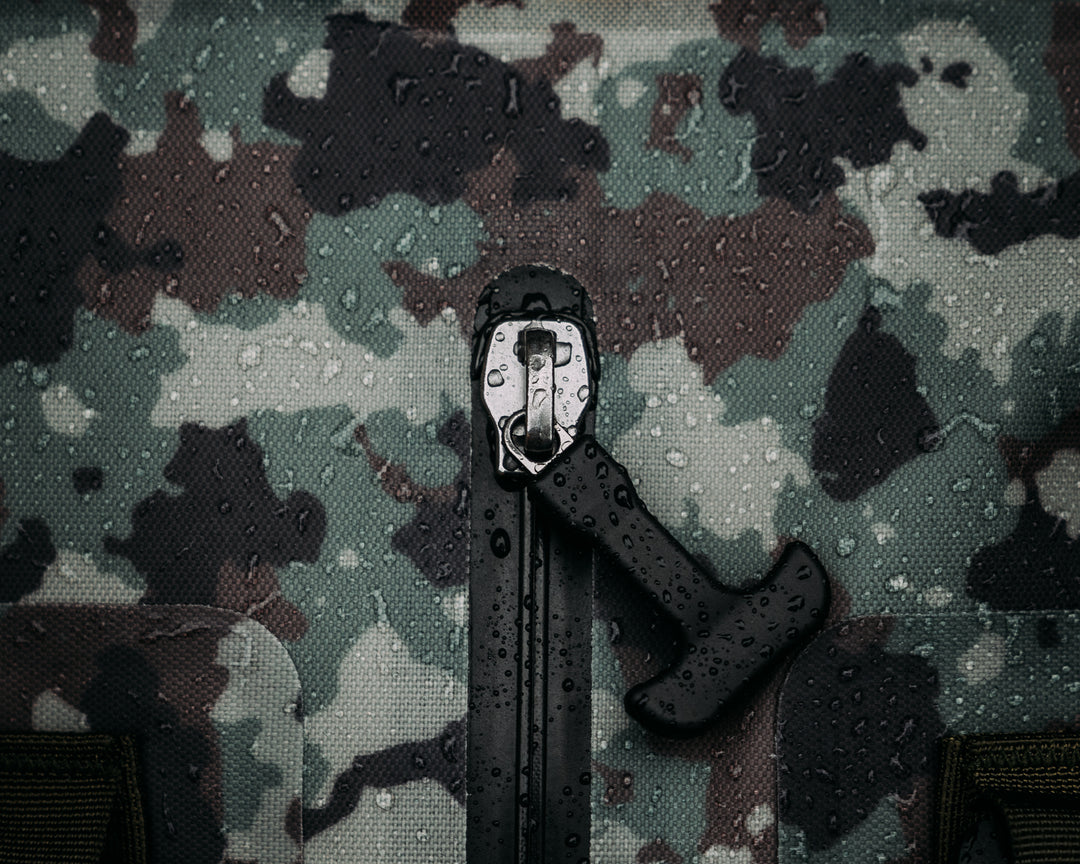Uncharted Supply Co. x Half Face Blades - The Vault 65L Duffel Bag