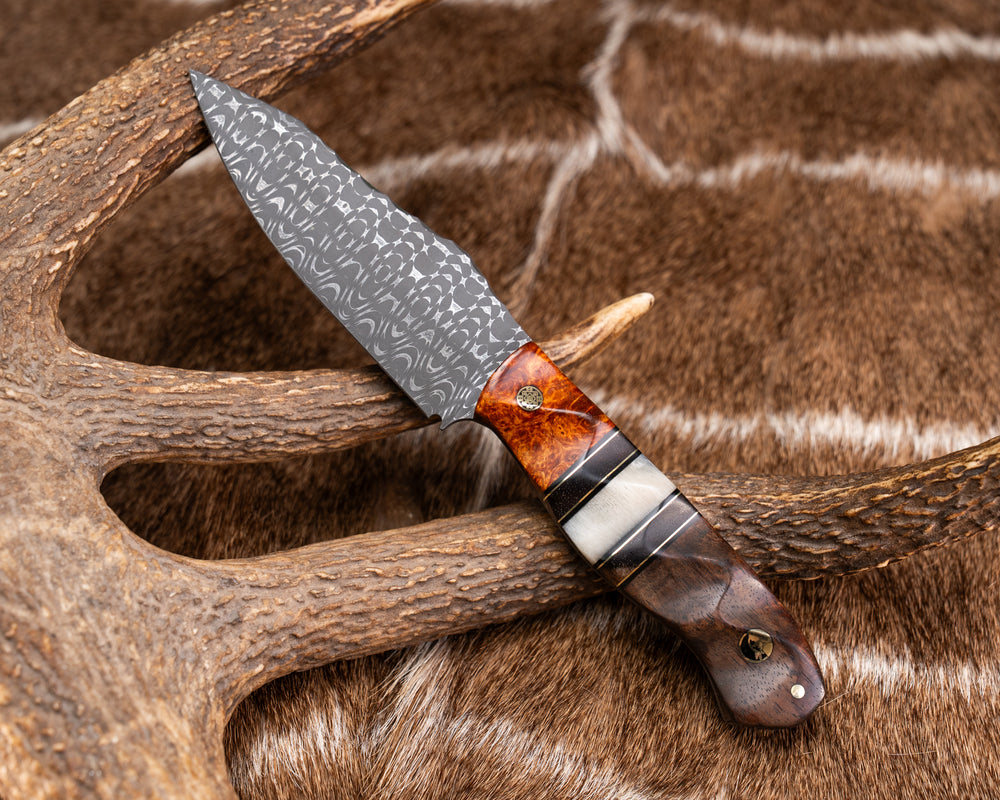 Field Knife - Vegas Forge Razorwire Damascus - Amboyna Burl, Black G10 and Brass Pin Striping, Hawaiian Curly Koa and Rams Horn Split, Hawiian Curly Koa, Mosaic Pin, Half Face Mosaic Pin, 1/8" Brass Pin, Textured Grip