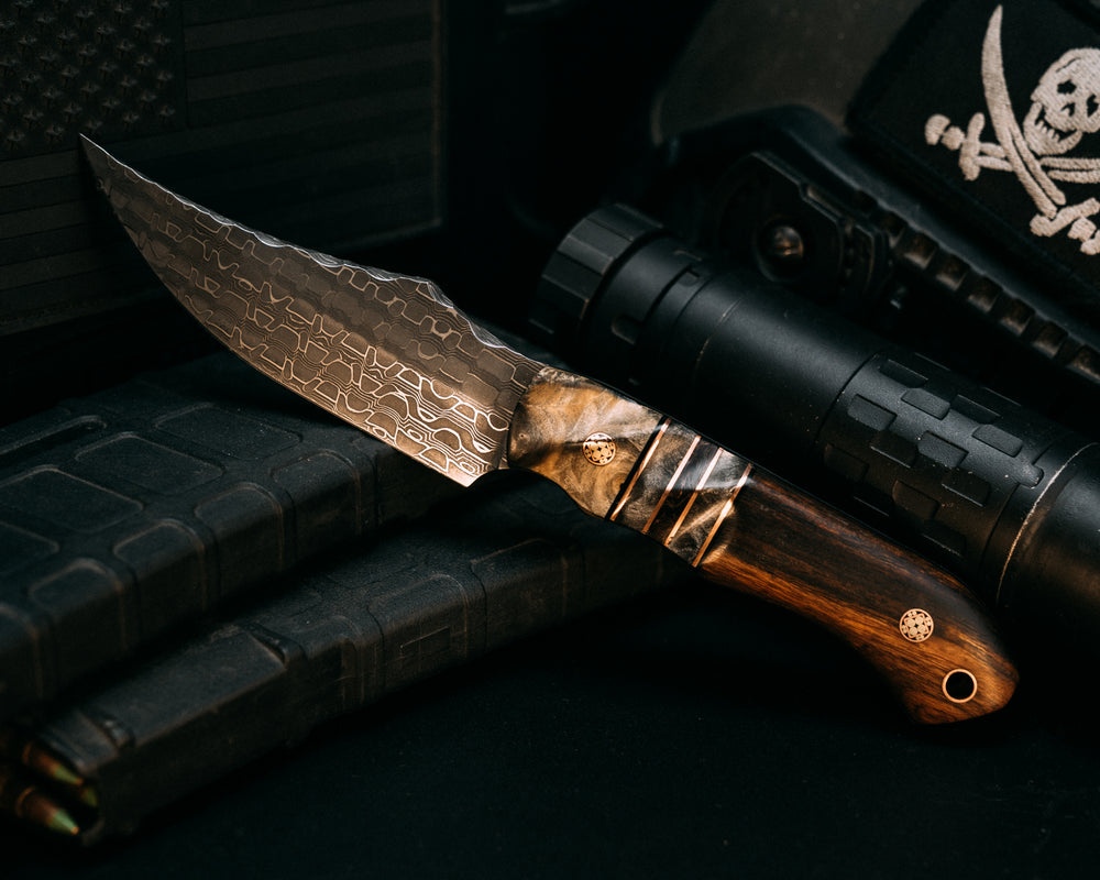Red Cloud- Vegas Forge Snakeskin Damascus- Buckeye Burl, Black G10 and Copper Pin Striping, Buckeye Burl and Copper Dark Matter Carbon Split, Desert Ironwood, Mosaic Pins, Copper Lanyard Pin, Contoured Grip