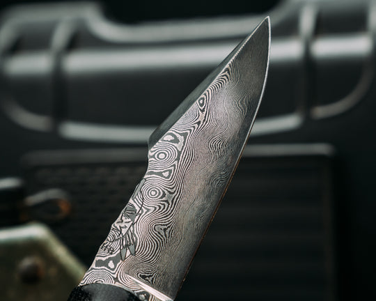 Widow Maker Jr- Baker Forge Raindrop Damascus- Black Canvas Miacrta, Black G10, White G10 and Aluminum Pin Striping, Black with White Web Tru-stone Split, Hawaiian Curly Koa, Mosaic Pins, Textured Grip