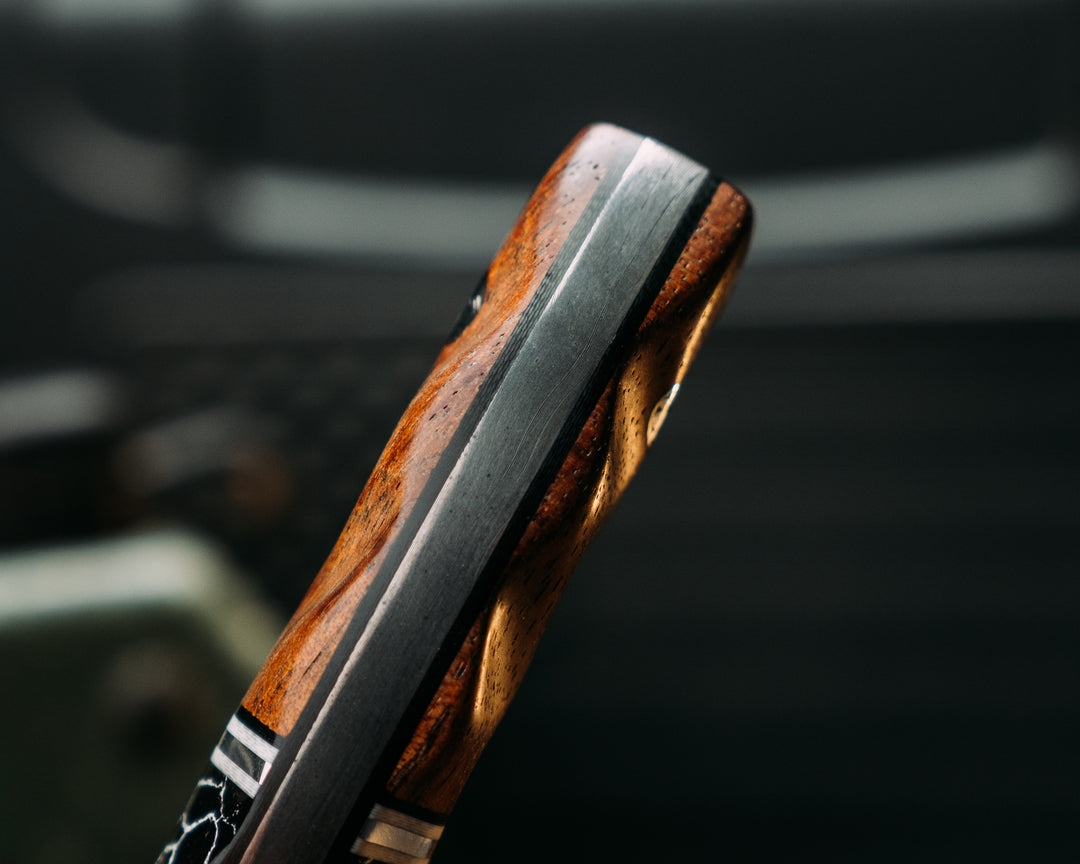 Widow Maker Jr- Baker Forge Raindrop Damascus- Black Canvas Miacrta, Black G10, White G10 and Aluminum Pin Striping, Black with White Web Tru-stone Split, Hawaiian Curly Koa, Mosaic Pins, Textured Grip
