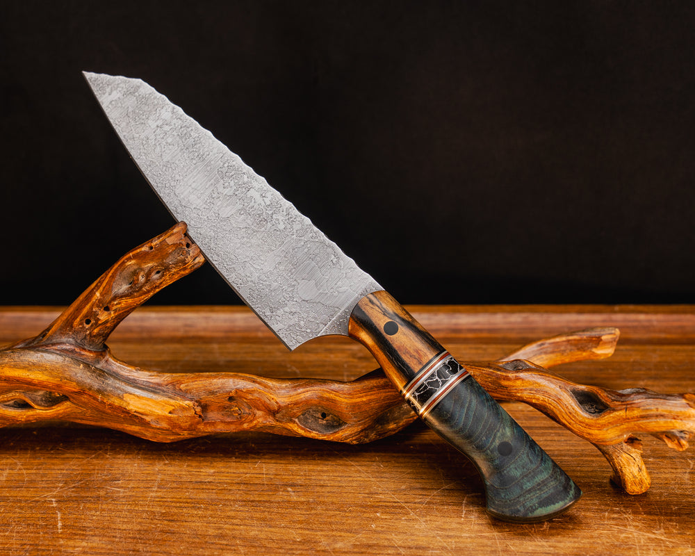 Santoku- Black and White Ebony, Black G10, Grey G10, Brass, Natural Canvas Micarta, and Aluminum Pin Striping, Black with White Web Tru-stone Split, Dyed Maple, CF Pins, Smooth Grip