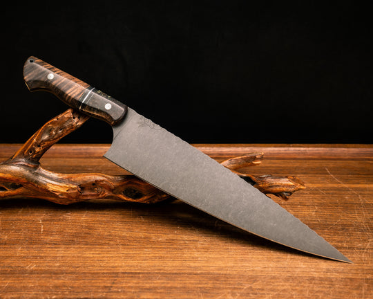 Chef Blade 10"- Dyed Black Ash, Black G10, Brass, and Aluminum Split, Hawaiian Curly Koa, Mosaic Pins, CF Lanyard Pin, Smooth Grip