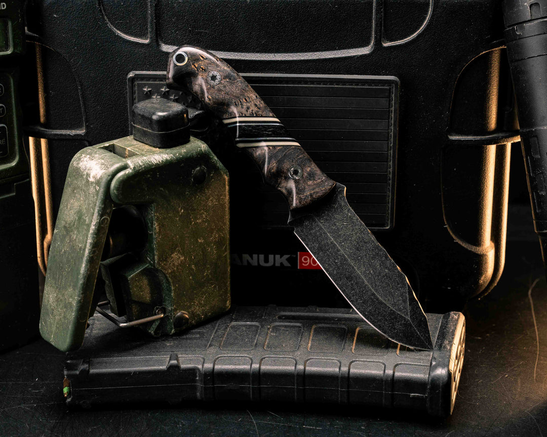 Disaster Cub- Dyed Black Ash Burl, Black Ga0, Desert Tan G10 and Aluminum Pin Striping, Black Canvas Micarta Split, Mosaic Pins, Aluminum Lanyard Pin, Smooth Grip