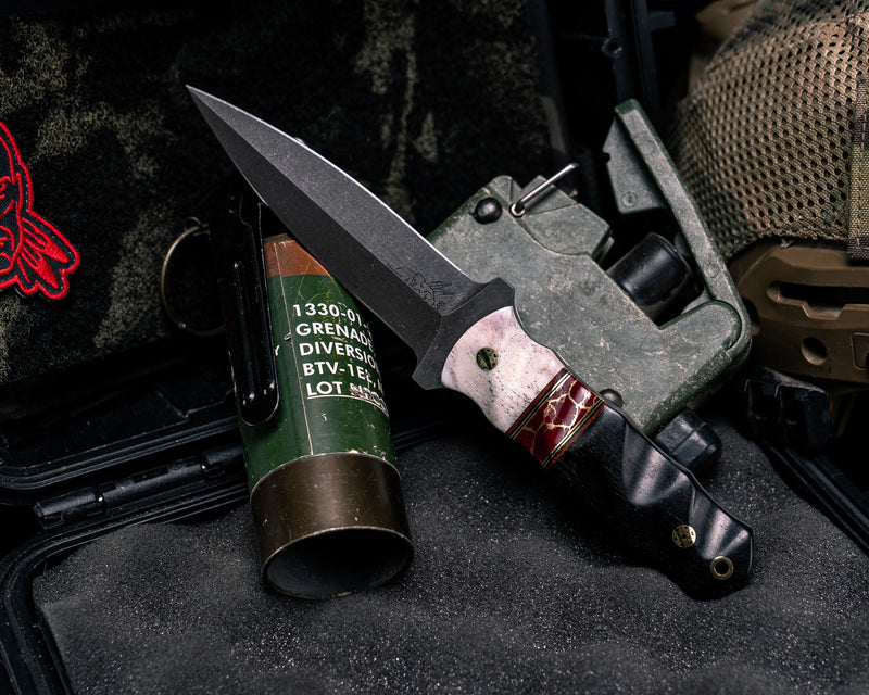 Combat Dagger- CO Elk Antler, Brown Canvas Micarta, Black G10 and Brass Pin Striping, Red with Gold Web Tru-stone Split, African Blackwood, Mosaic Pins, Brass Lanyard Pin, Textured Grip