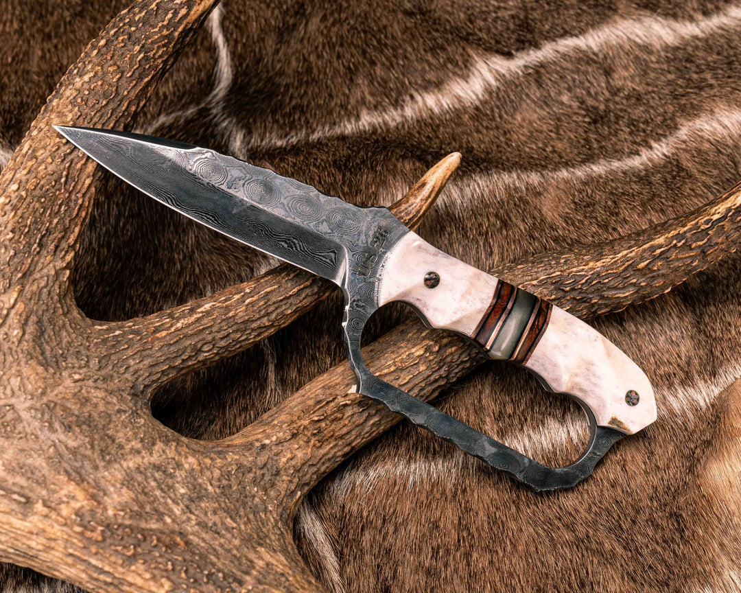 Trench Knife- Baker Forge Raindrop Damascus- Elk Antler, Black G10 and Copper Pin Striping, Desert Ironwood and Rams Horn Split, Mosaic Pins, Textured Grip