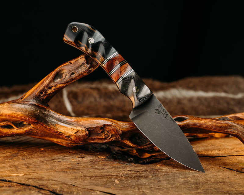 Modified Cavner- Gold Camo Carbon, Black G10 & Brass Pin Striping, Texas Mesquite split, Black and white ebony Mosaic Pins, Brass Lanyard Pin, Textured Grip.