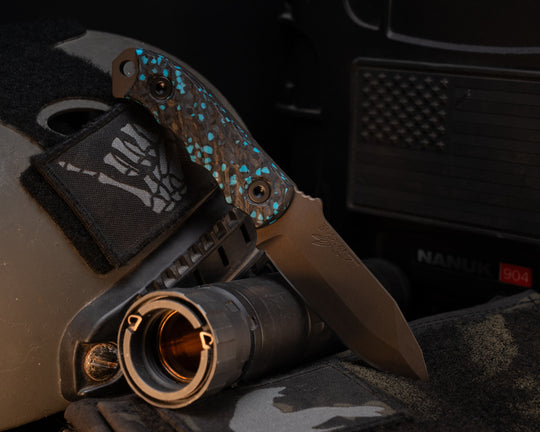 Disaster Cub- Turquoise RockyWave Carbon, Midnight Bronze Cerakote, Allen Bolts, Textured Grip