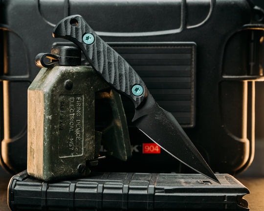 Gulo Gulo- Black G10, Armor Black Cerakote, Green Ti Allen Bolts, Textured Grip
