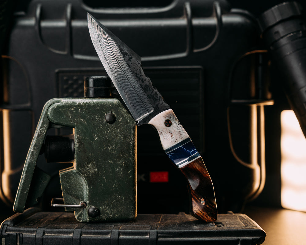 Widow Maker Jr- Baker Forge Random Pattern Damascus- Elk Antler, White G10, Aluminum, Blue G10 and Grey G10 Pin Striping, Sodalite Tru-stone Split, Hawaiian Curly Koa, Mosaic Pins, 1/8" Brass Mosaic Pin, Textured Grip