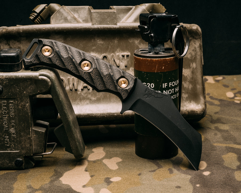 Vulture - gold camo carbon, armor black cerakote, brass allen bolts, iron grip, open tang