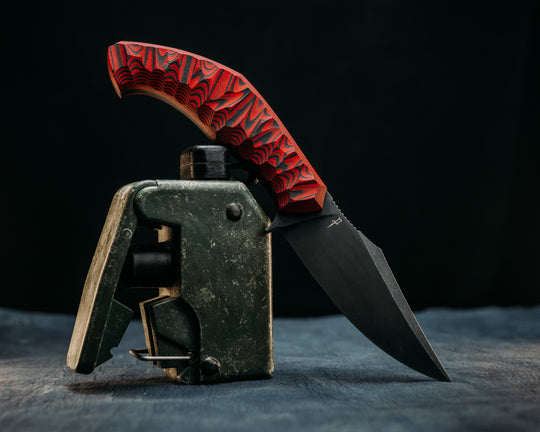 Half Face Blades X Dire Pacific Giveaway - Recurve Fighter - 400 Layered Dire Pacific Forged Damascus - Brass Bolster w/ Crystallized Titanium Guard Inlay, African Blackwood, Solid Brass Pommel, Crystalized Titanium Pommel Cap, Bronze Pins, Textured Grip.