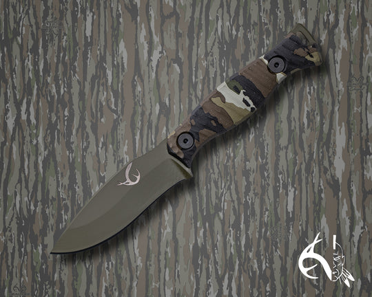 The 86' (HFB x Realtree) - Realtree Original Camo Hydro-dipped Micarta, Sniper Green Cerakote, Allen Bolts, Textured Grip.